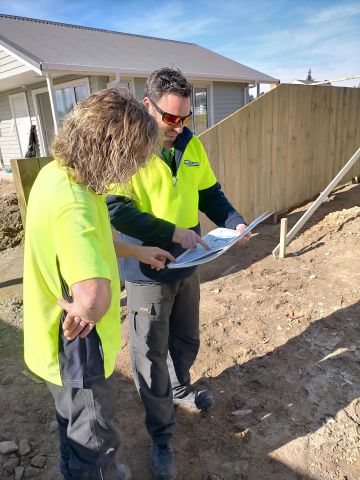 Gene and Aaron Planning and Discussing Fence Heights and Measurements